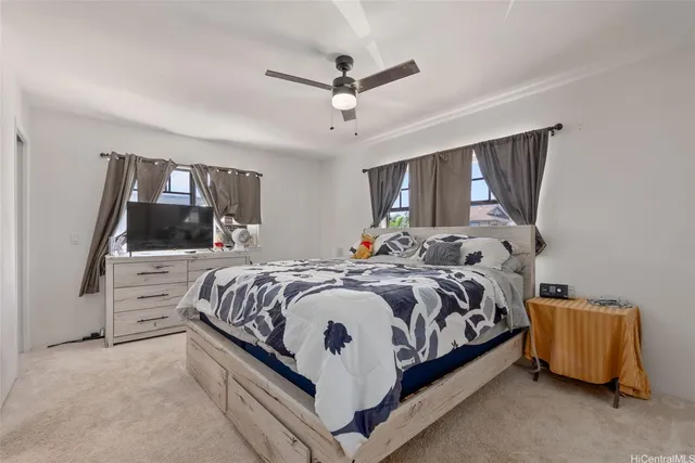 a bed room with a bed and window