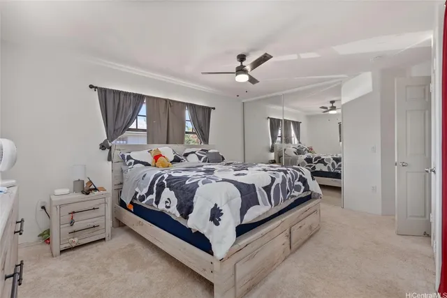 a bed room with a bed and a chair