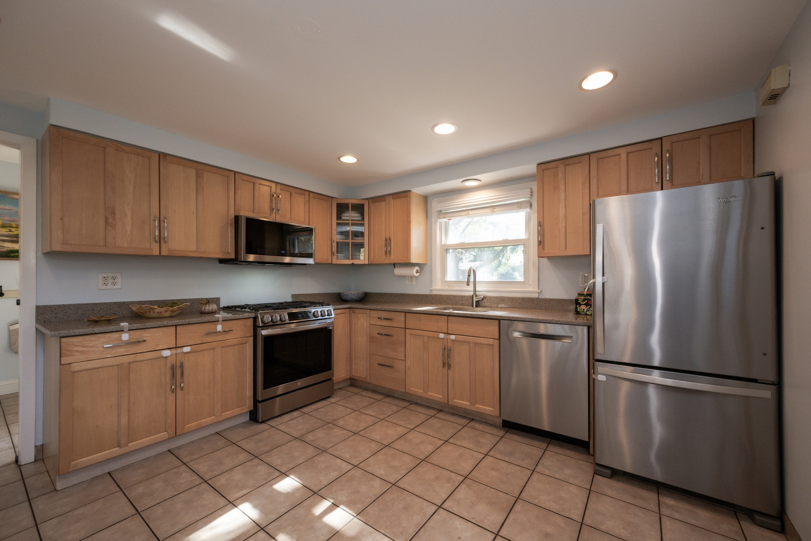 950 Brookside Lane Deerfield, IL 60015 - Photo 13 of 13 a kitchen with stainless steel appliances granite countertop a refrigerator sink and stove