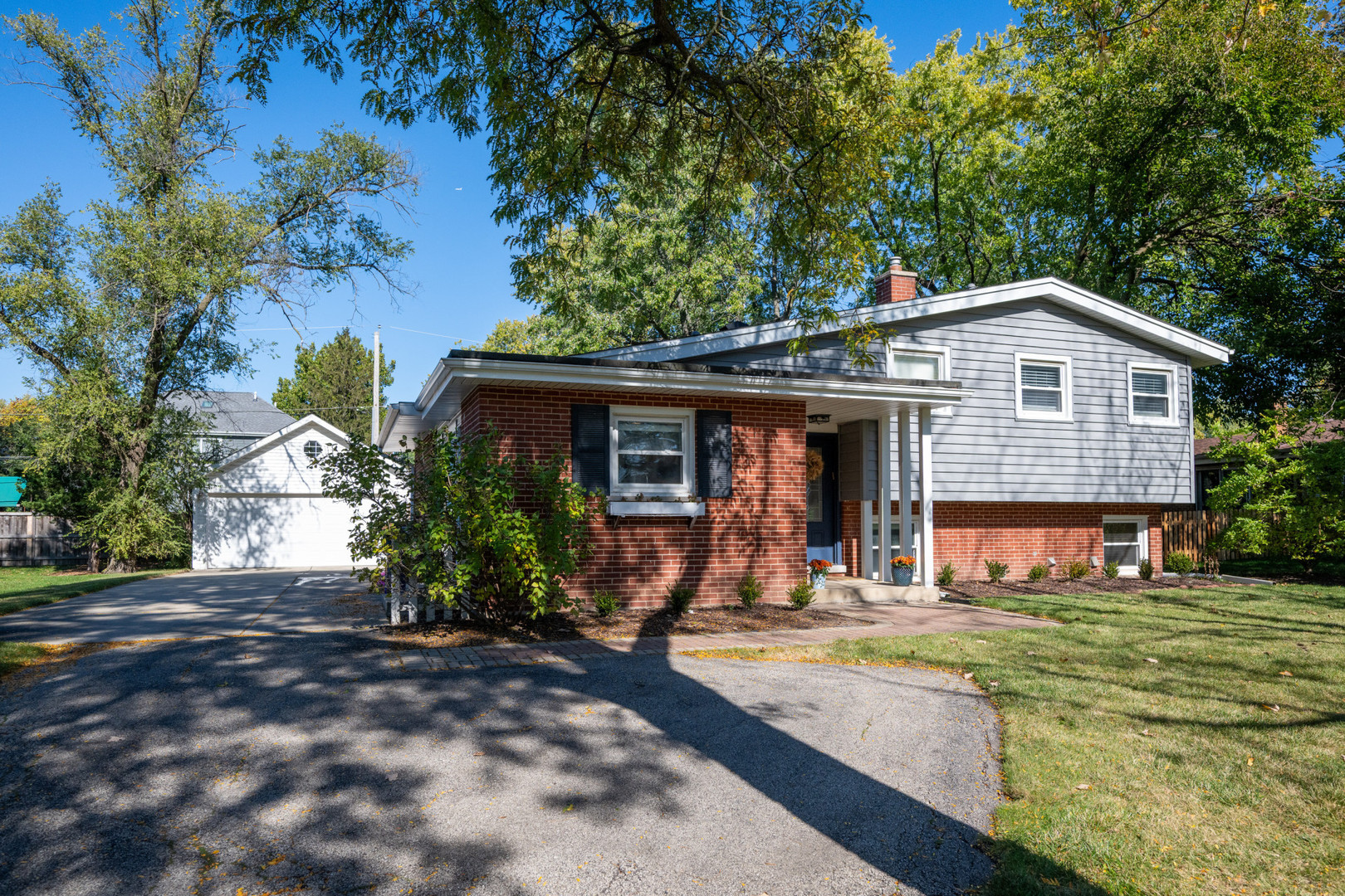 950 Brookside Lane Deerfield, IL 60015 - Photo 2 of 13 a front view of a house with garden