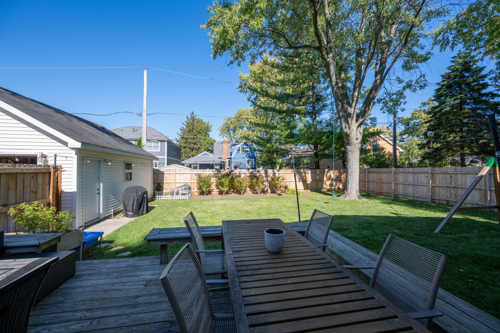 950 Brookside Lane Deerfield, IL 60015 - Photo 3 of 13 a view of a table and chairs in patio with wooden fence
