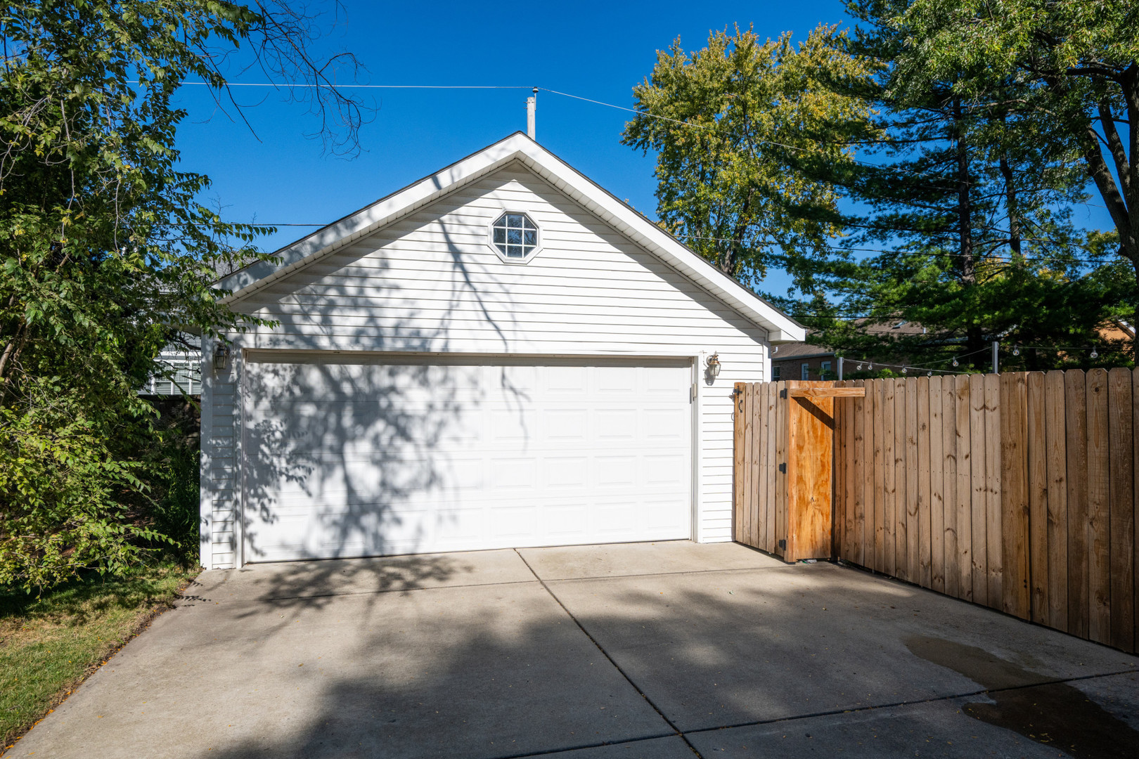 950 Brookside Lane Deerfield, IL 60015 - Photo 7 of 13 a view of a house with a yard and garage