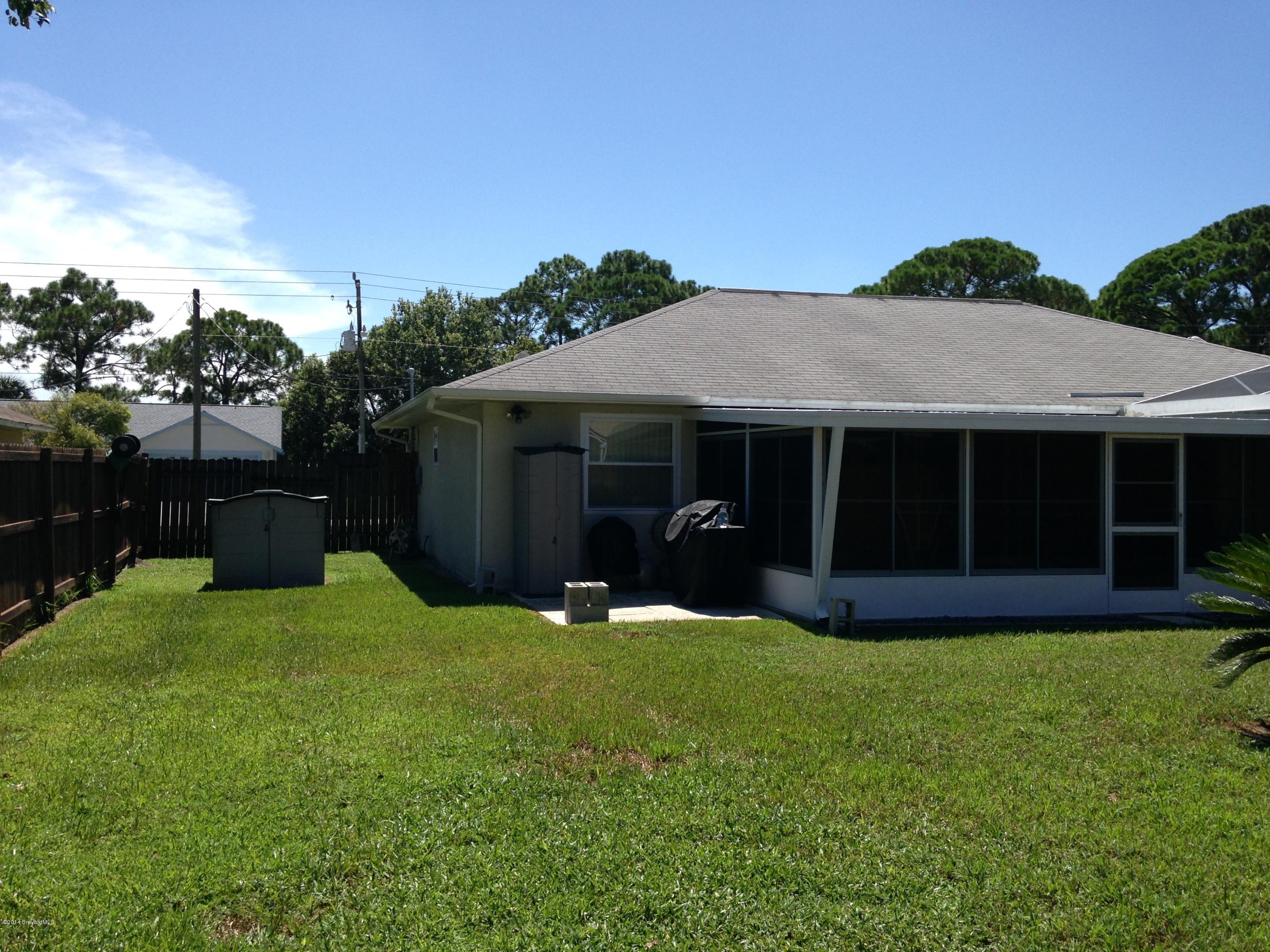 5246 Bridge Road Cocoa, FL 32927 - Photo 29 of 44 BACKYARD VIEW DOUBLE FENCE THAT OPENS