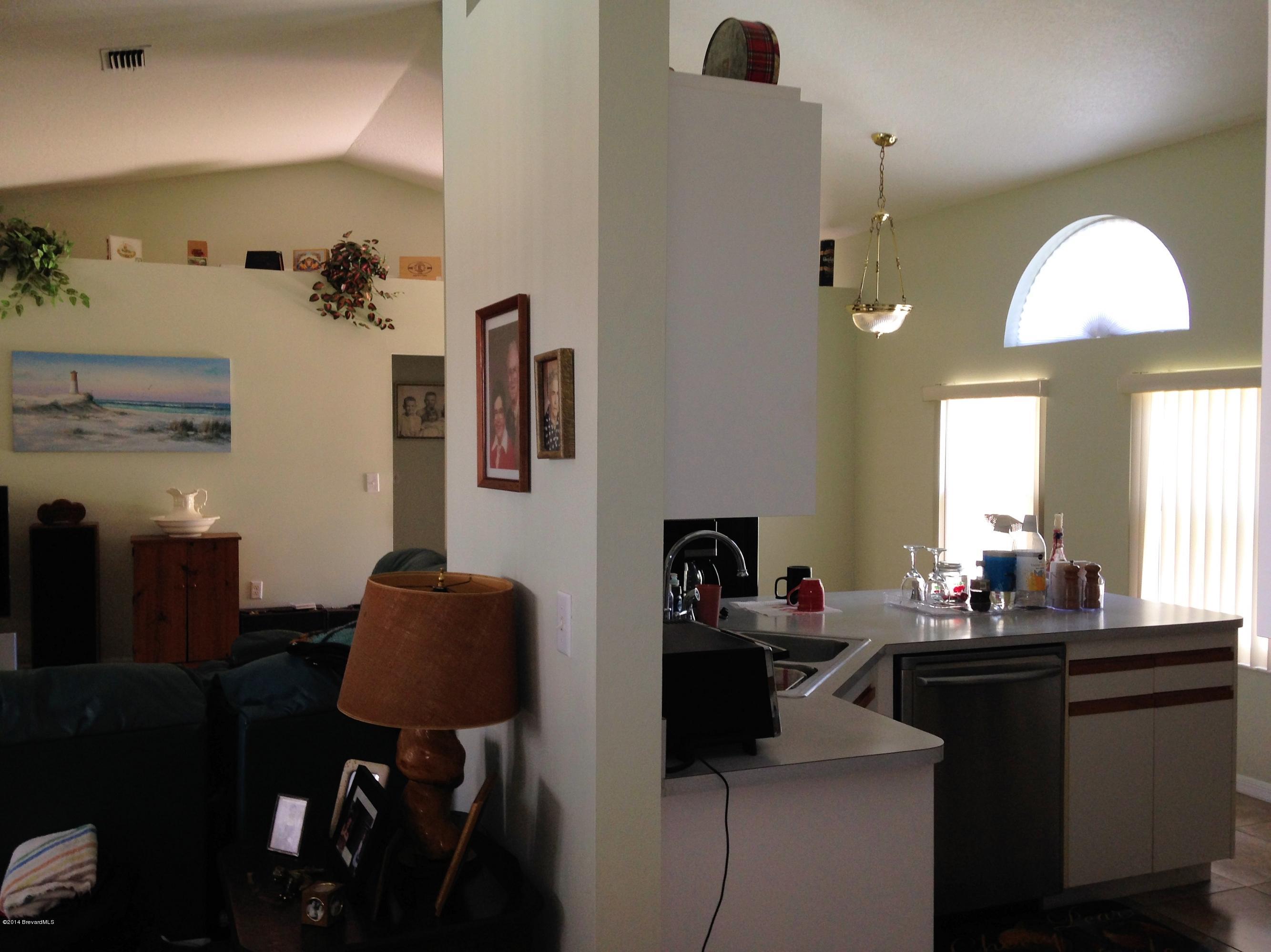5246 Bridge Road Cocoa, FL 32927 - Photo 7 of 44 DRIFT WALL BETWEEN KITCHEN & LIVING ROOM