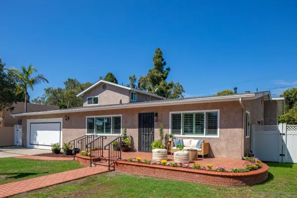 a front view of house with yard patio and green space