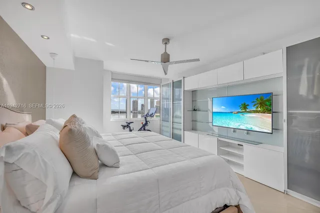 a bathroom with a double vanity sink mirror and shower