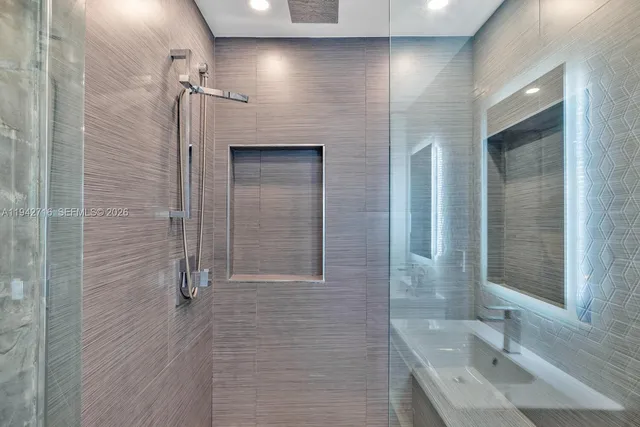 a roof deck with couch and city view