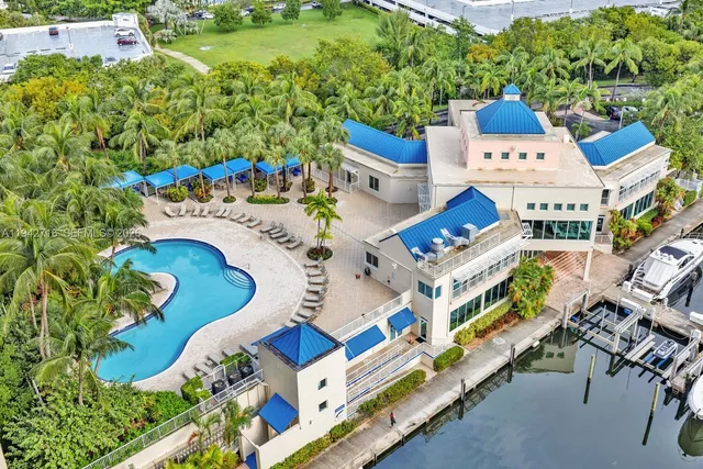 a view of a swimming pool with a potted plants