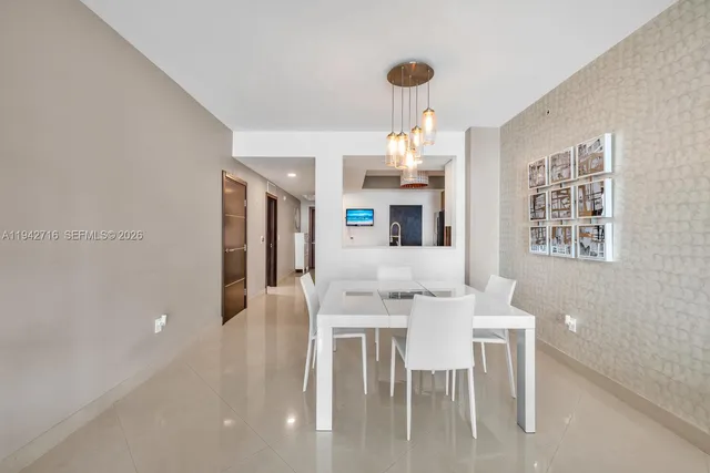 a living room with furniture with kitchen view