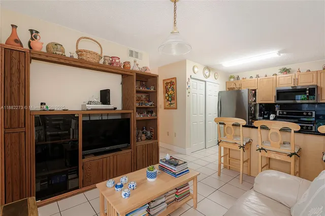 a bedroom with furniture and a book shelf
