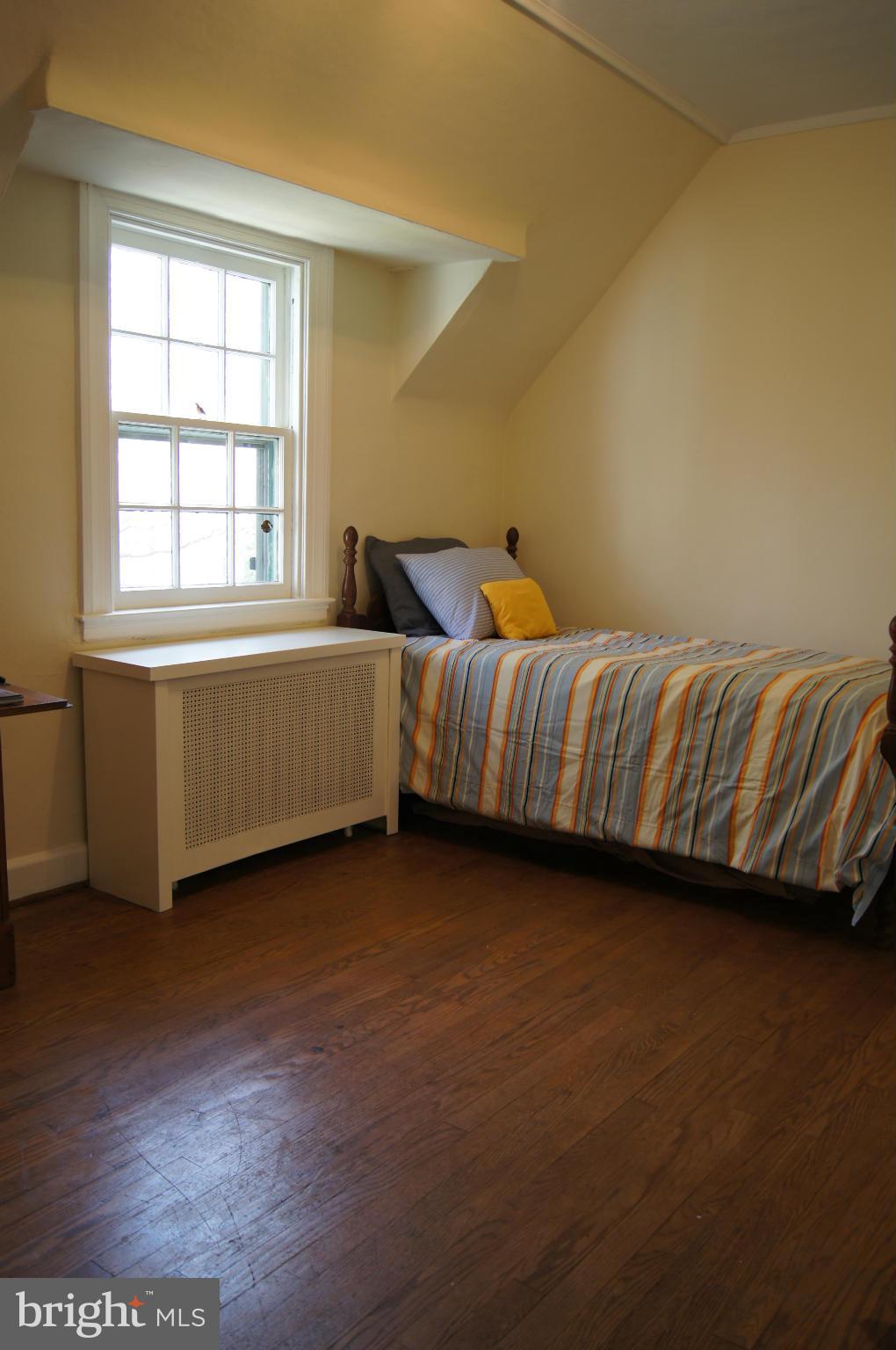 7101 Copeleigh Road Baltimore, MD 21212 - Photo 22 of 30 a room with a bed and a window