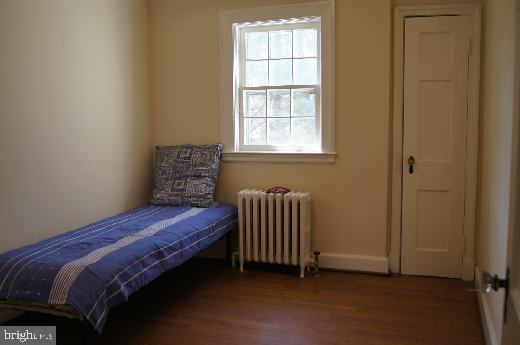 7101 Copeleigh Road Baltimore, MD 21212 - Photo 23 of 30 a bedroom with a bed and a window