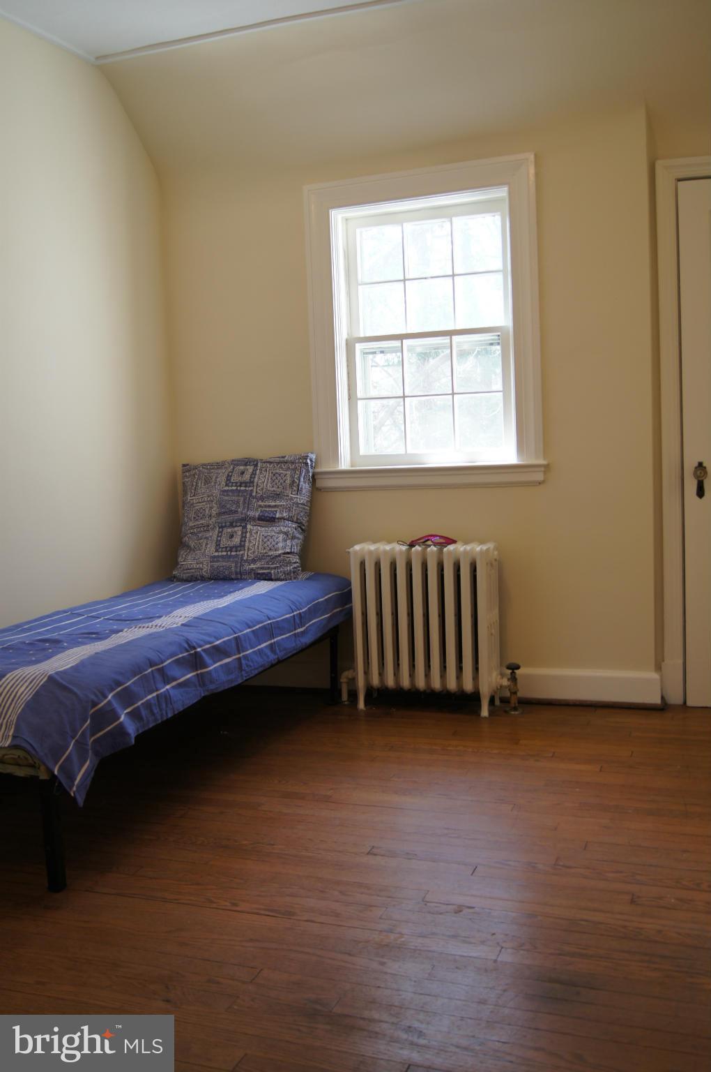 7101 Copeleigh Road Baltimore, MD 21212 - Photo 24 of 30 a bedroom with a bed and a window