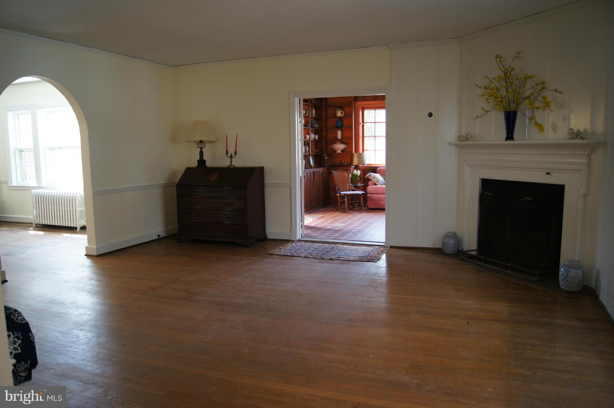 7101 Copeleigh Road Baltimore, MD 21212 - Photo 4 of 30 a living room with furniture and a fireplace
