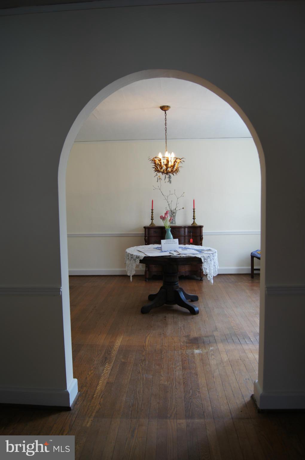 7101 Copeleigh Road Baltimore, MD 21212 - Photo 6 of 30 a living room with a table chairs and a table