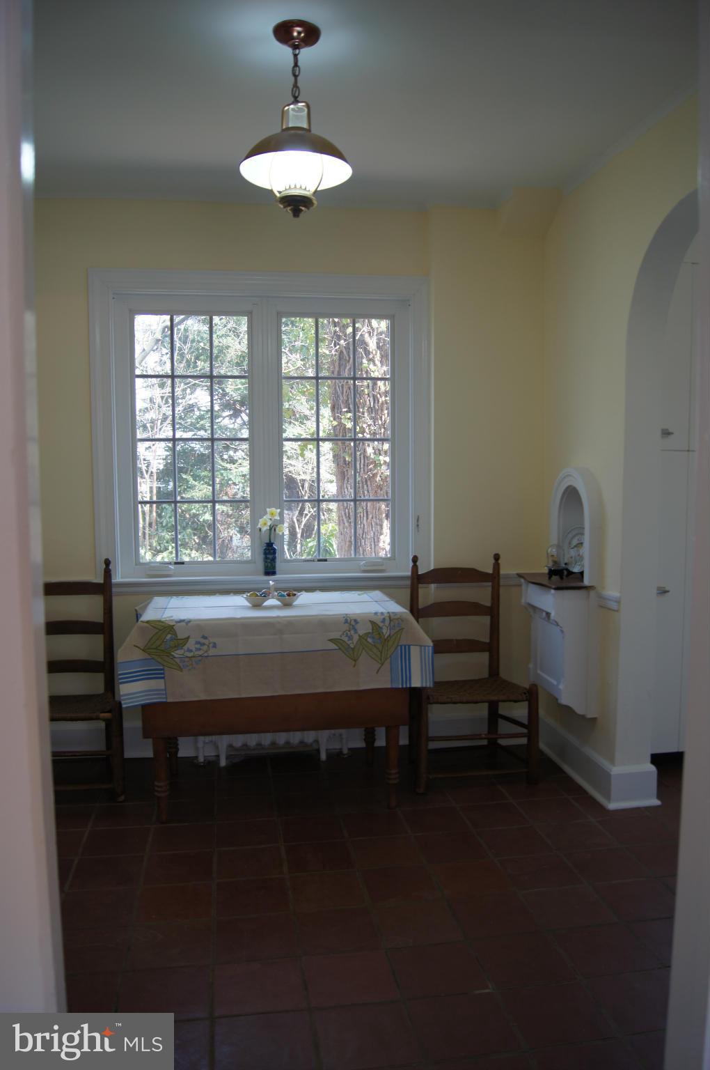 7101 Copeleigh Road Baltimore, MD 21212 - Photo 10 of 30 a spacious bedroom with a bed and a chandelier