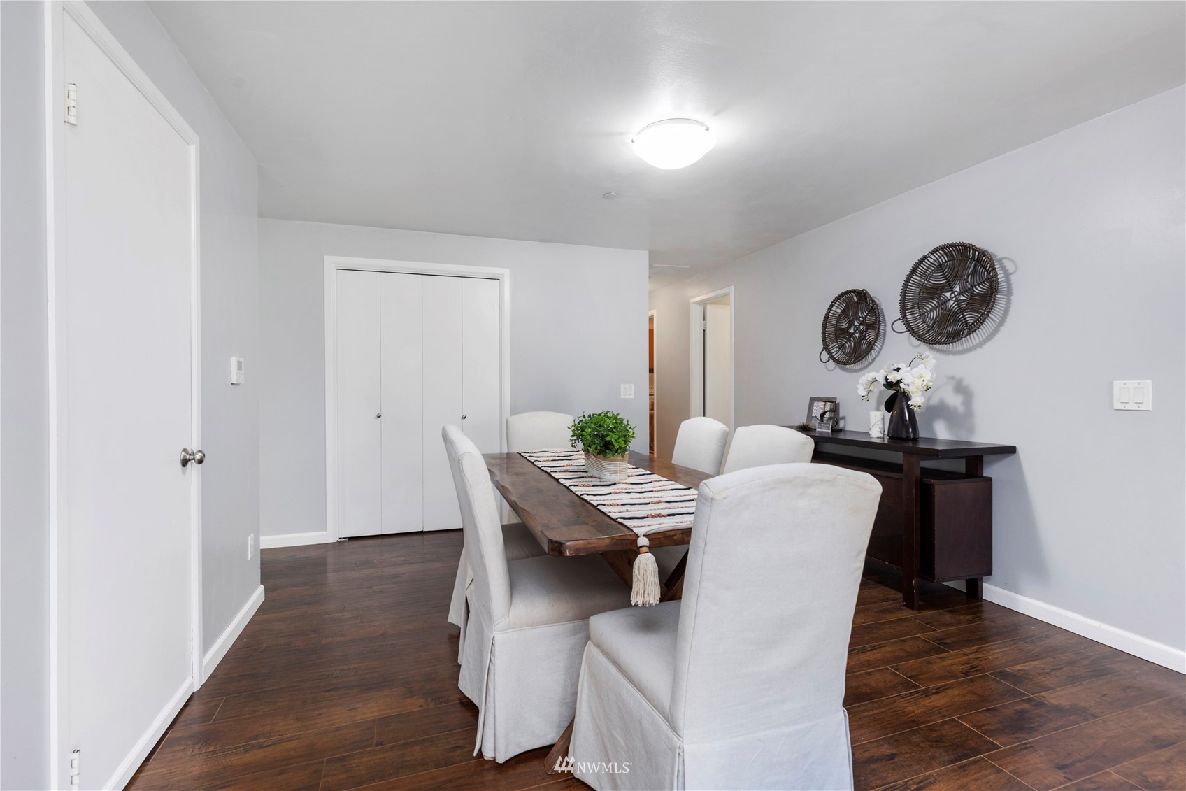 4514 Northeast 17th Place Renton, WA 98059 - Photo 21 of 39 a view of a dining room with furniture and wooden floor