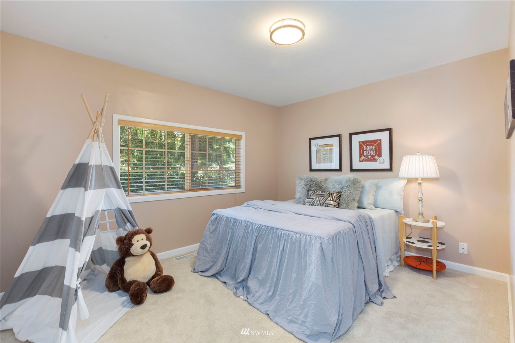 4514 Northeast 17th Place Renton, WA 98059 - Photo 27 of 39 a bedroom with a bed and a large window