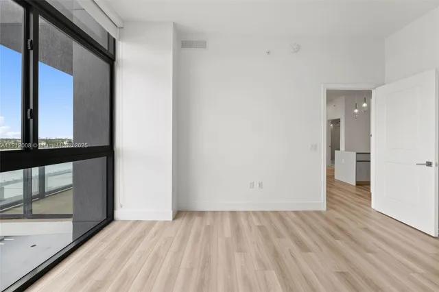 a spacious bathroom with a double vanity and a shower