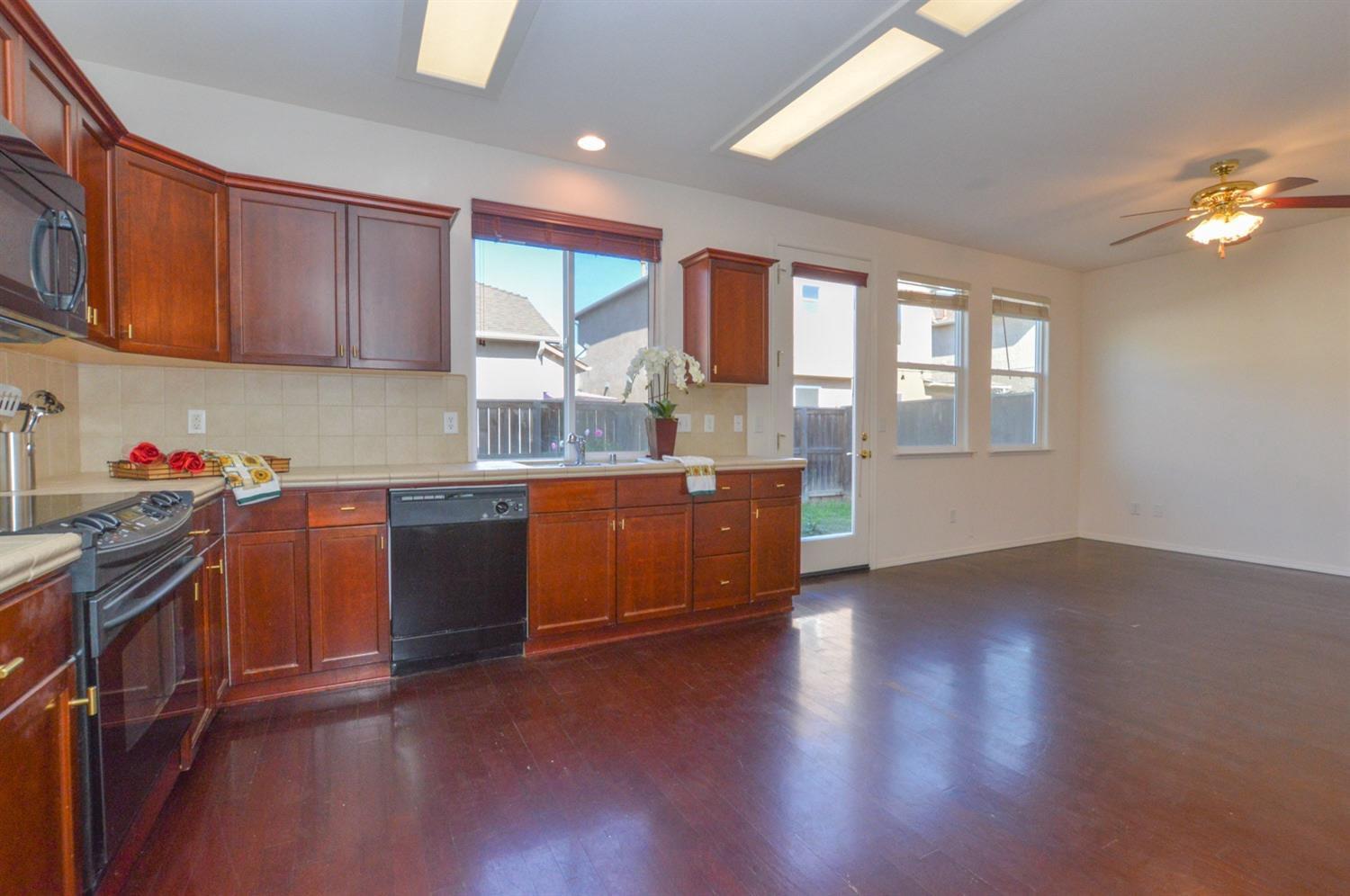 1687 Glen Oban Lane Clovis, CA 93619 - Photo 9 of 20 kitchen to family room to backyard