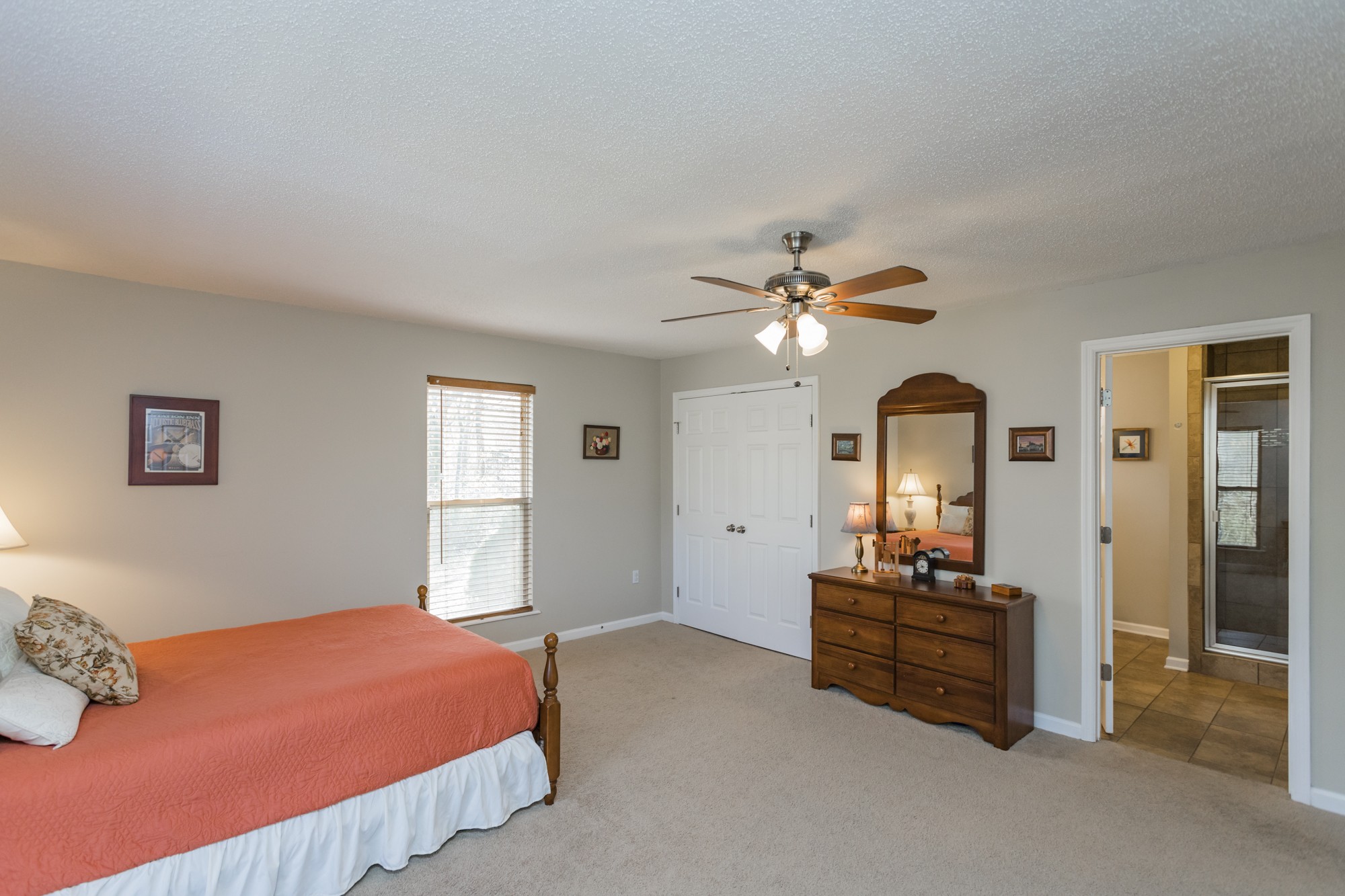 4306 Kedron Road Spring Hill, TN 37174 - Photo 11 of 35 a bedroom with a bed and a chandelier