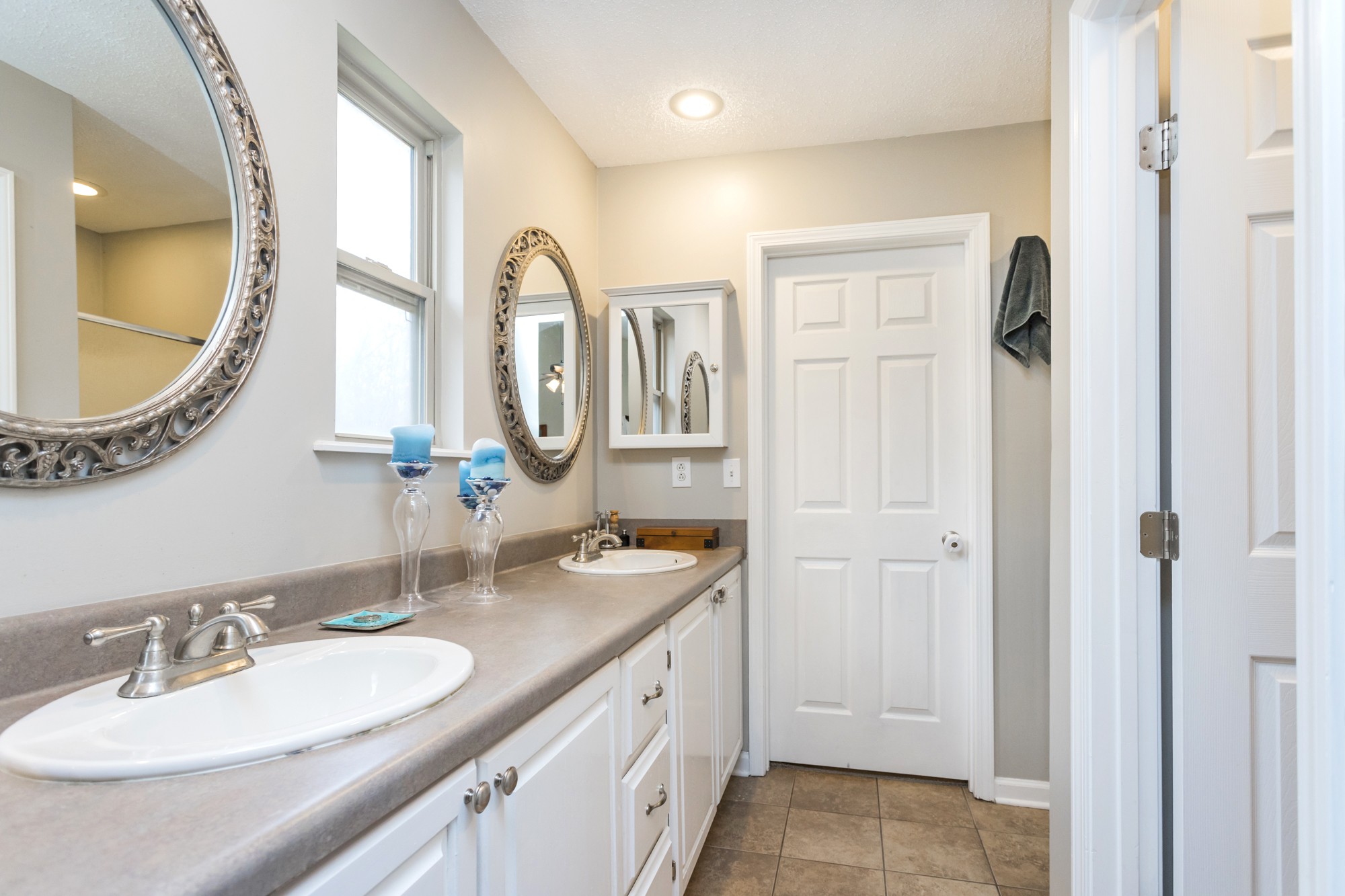 4306 Kedron Road Spring Hill, TN 37174 - Photo 18 of 35 a spacious bathroom with a double vanity sink and a mirror