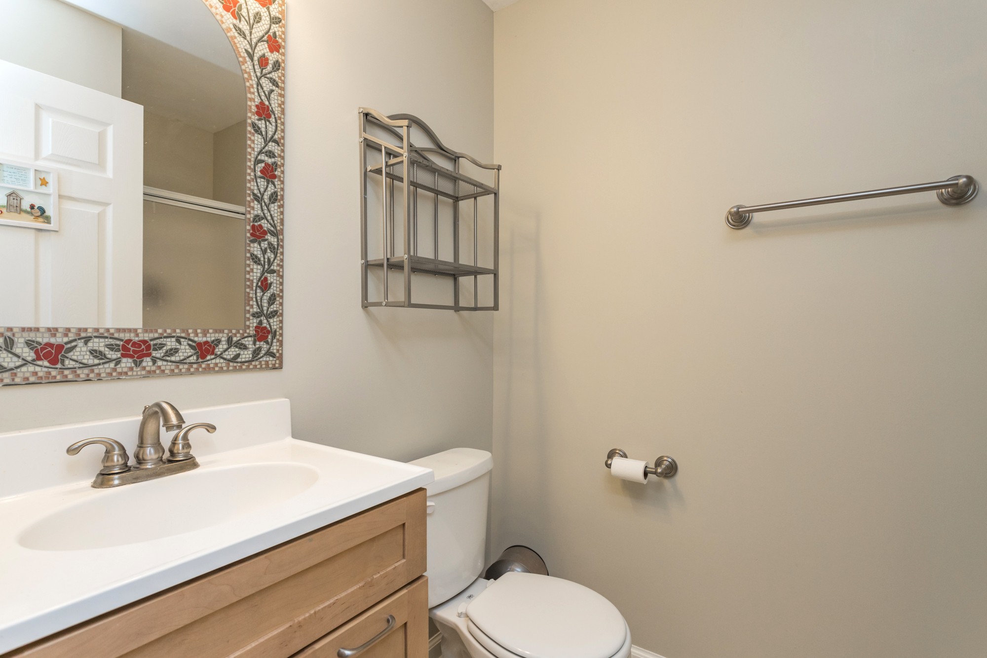 4306 Kedron Road Spring Hill, TN 37174 - Photo 24 of 35 a bathroom with a sink vanity mirror and toilet