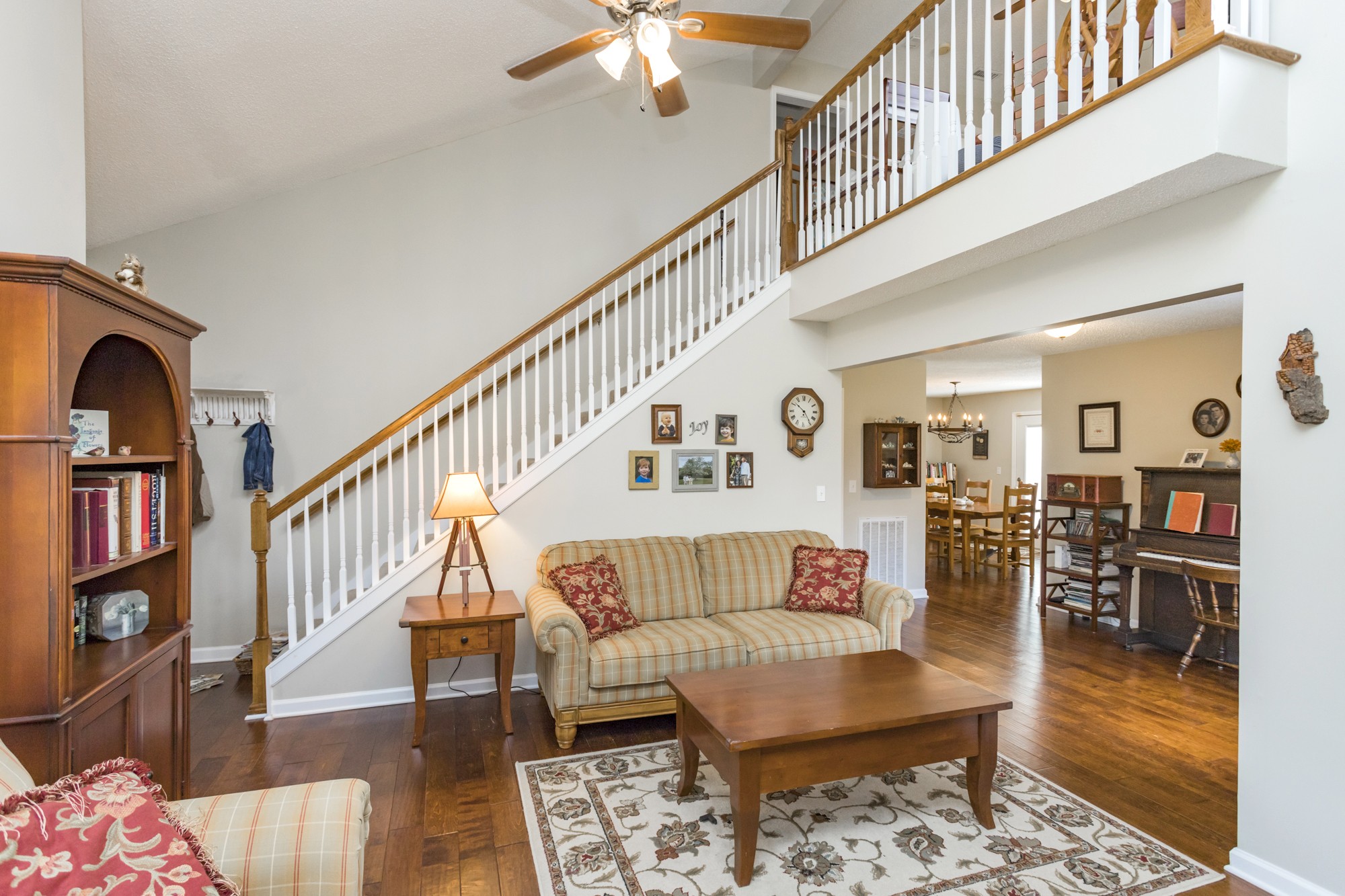 4306 Kedron Road Spring Hill, TN 37174 - Photo 4 of 35 a living room with couches and a dining table with rug floor