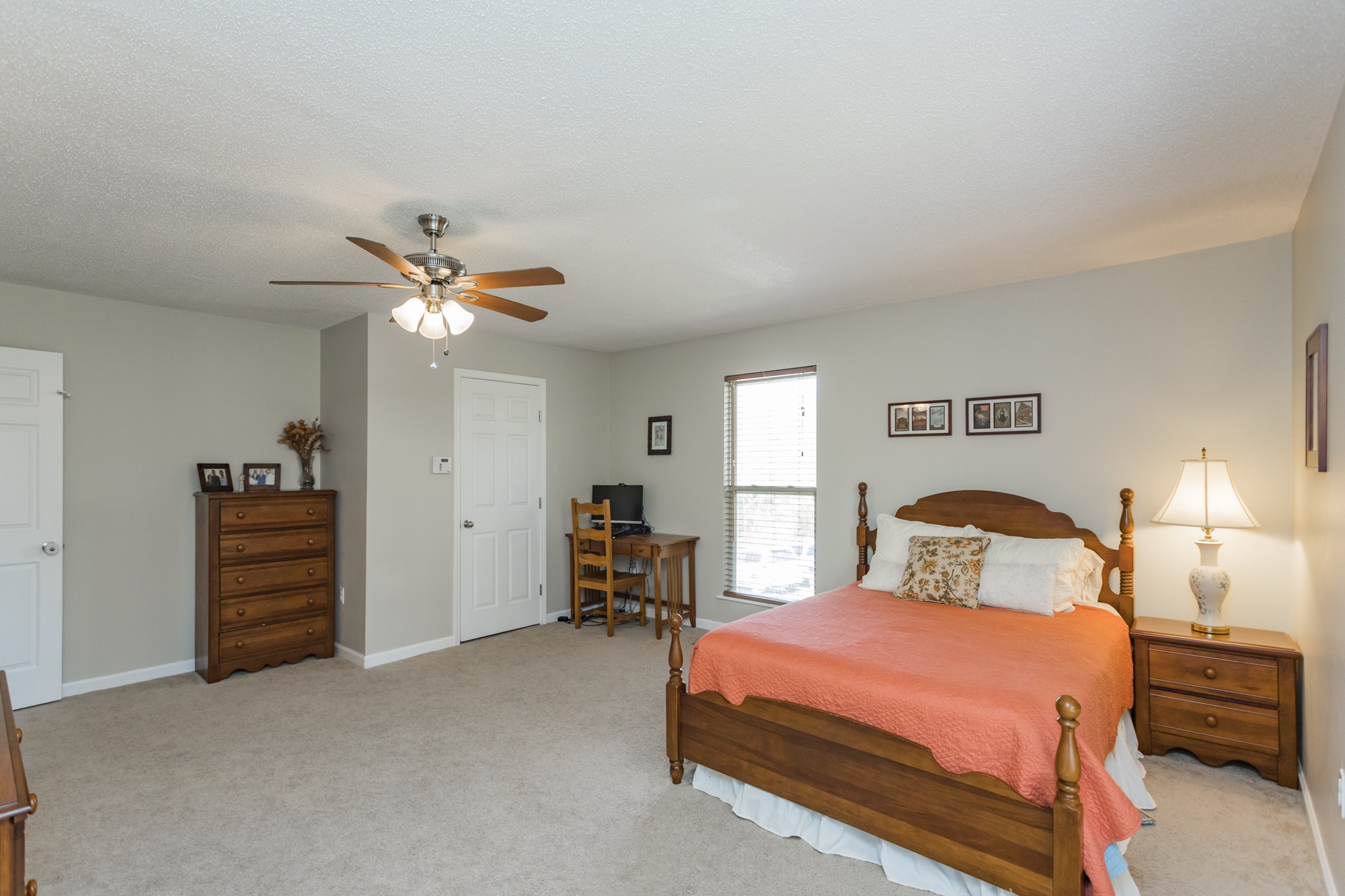 4306 Kedron Road Spring Hill, TN 37174 - Photo 10 of 35 a bedroom with a bed and a chandelier