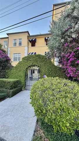 a view of a dining room with furniture and a flat screen tv