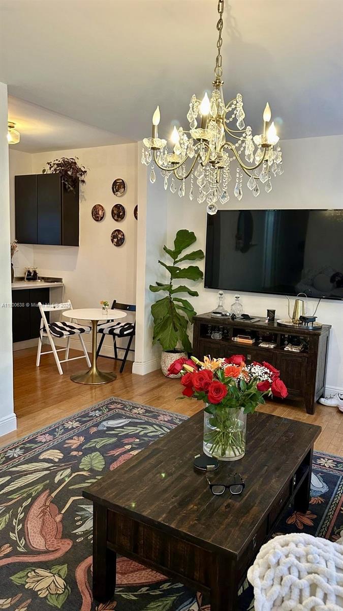 4812 Pine Tree Drive, Unit 204 Miami Beach, FL 33140 - Photo 24 of 43 a view of a dining room with furniture and a flat screen tv