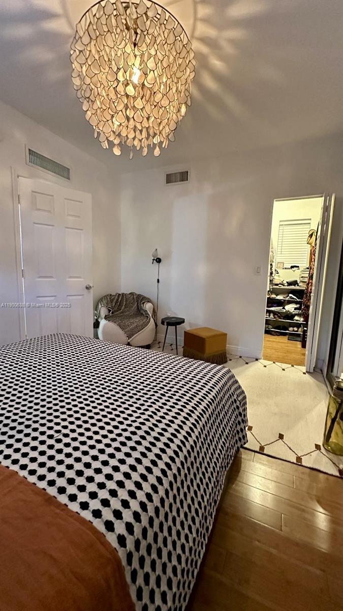 4812 Pine Tree Drive, Unit 204 Miami Beach, FL 33140 - Photo 37 of 43 a bedroom with a bed and a window