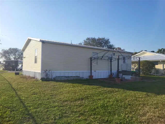 a view of a backyard of the house