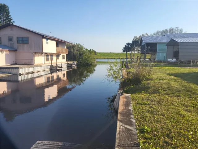 a swimming pool view with a outdoor seating space