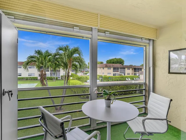 a room with furniture and a potted plant