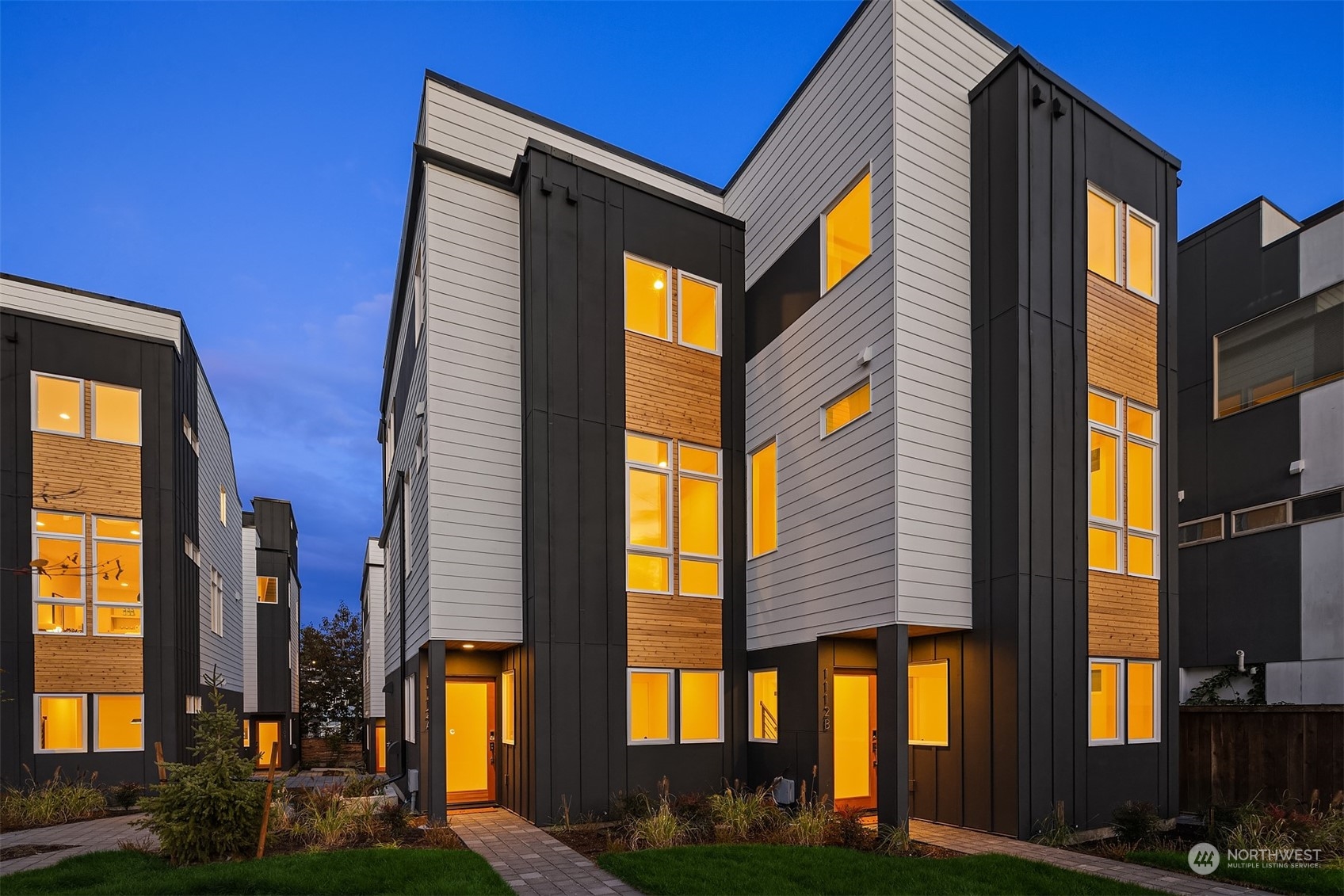1112 21st Avenue South, Unit A Seattle, WA 98144 - Photo 1 of 27 a view of a brick building with many windows