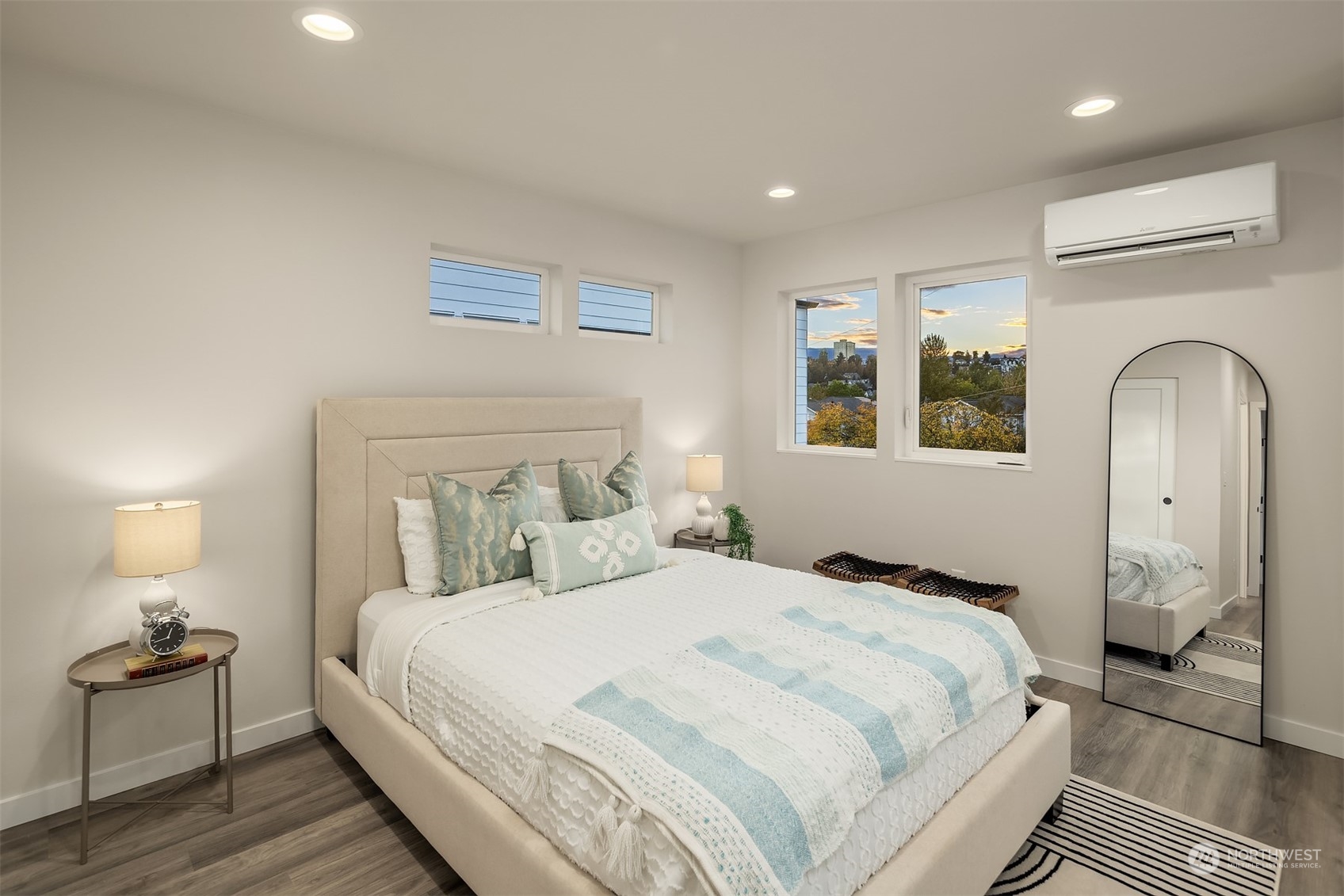 1112 21st Avenue South, Unit A Seattle, WA 98144 - Photo 12 of 27 a bedroom with a bed and a lamp