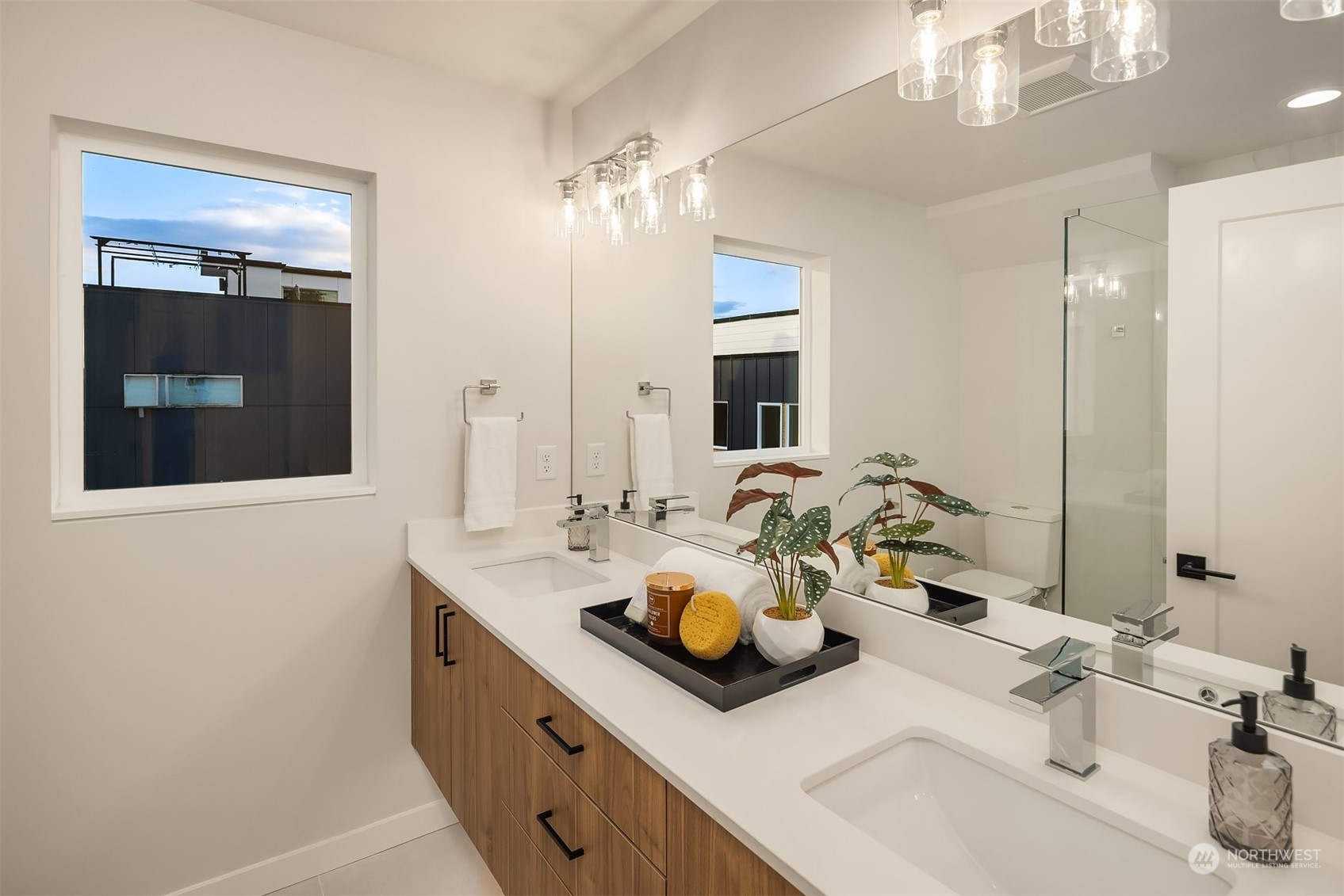 1112 21st Avenue South, Unit A Seattle, WA 98144 - Photo 14 of 27 a bathroom with a sink double vanity and a mirror