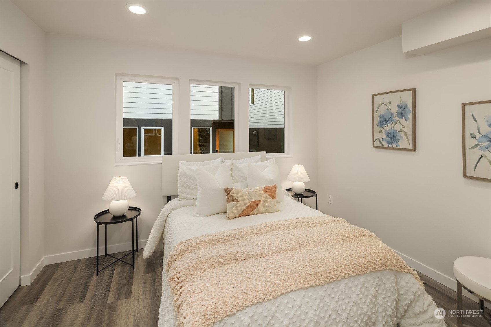 1112 21st Avenue South, Unit A Seattle, WA 98144 - Photo 18 of 27 a bedroom with a bed and wooden floor