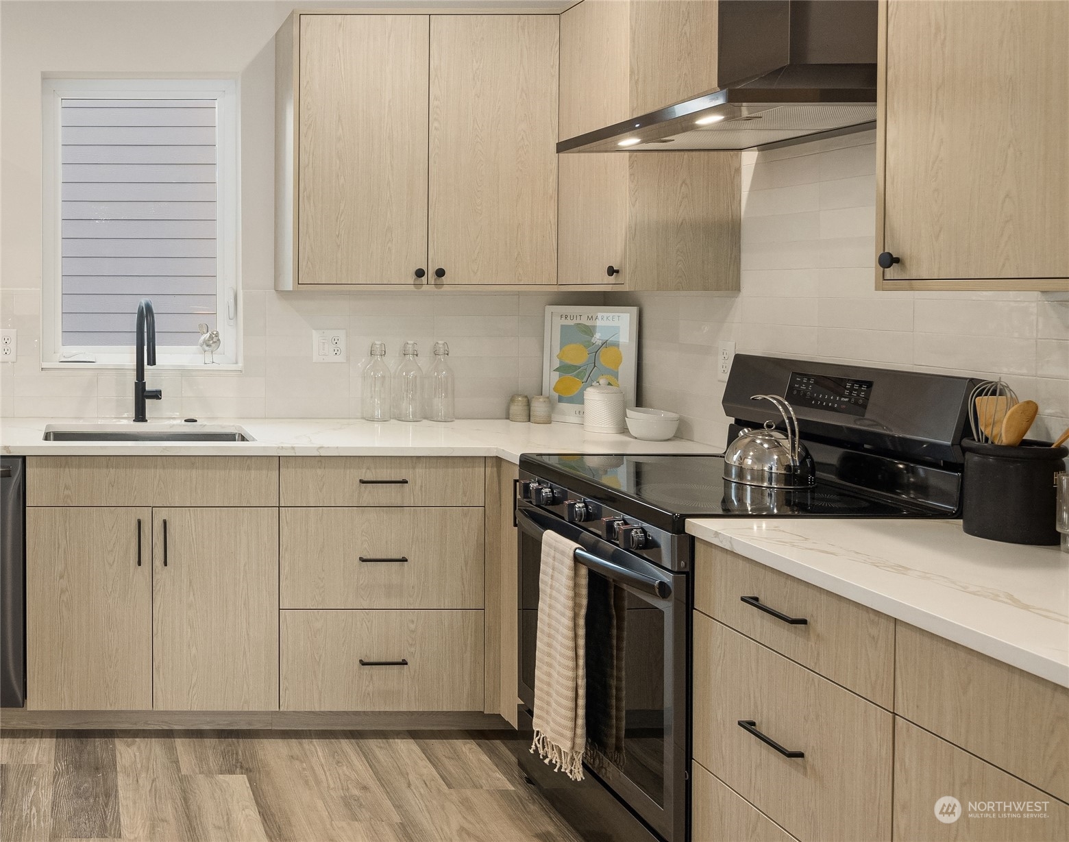 1112 21st Avenue South, Unit A Seattle, WA 98144 - Photo 6 of 27 a kitchen with white cabinets and appliances