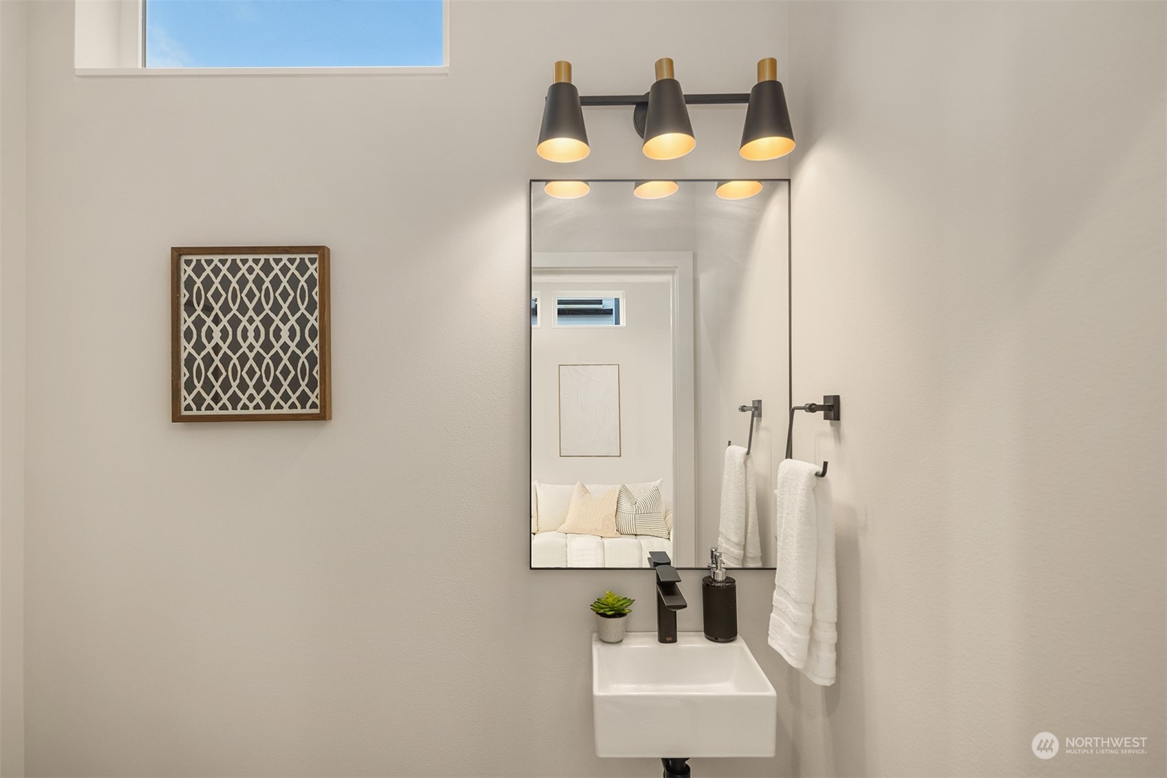 1112 21st Avenue South, Unit A Seattle, WA 98144 - Photo 10 of 27 a bathroom with a mirror and a sink
