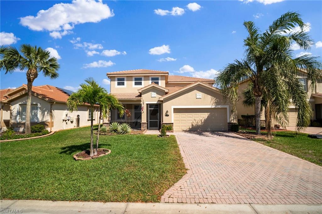 21620 Bella Terra Boulevard Estero, FL 33928 - Photo 1 of 37 a front view of a house with garden
