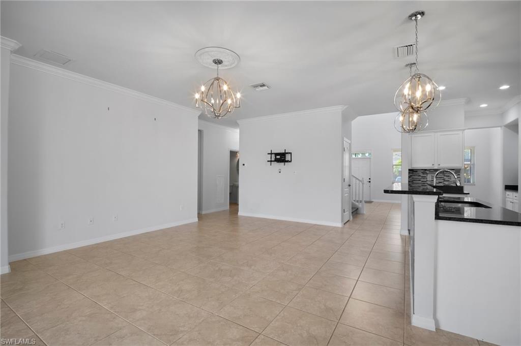 21620 Bella Terra Boulevard Estero, FL 33928 - Photo 11 of 37 a view of a kitchen with a sink and chandelier