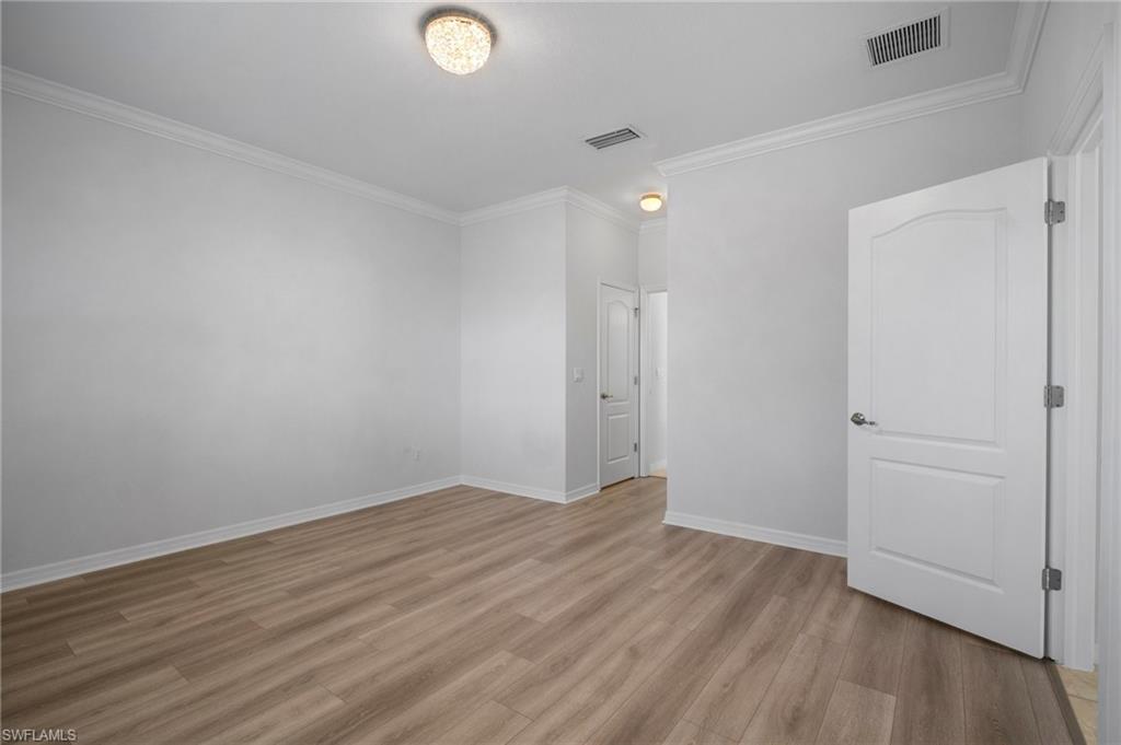 21620 Bella Terra Boulevard Estero, FL 33928 - Photo 17 of 37 wooden floor in an empty room