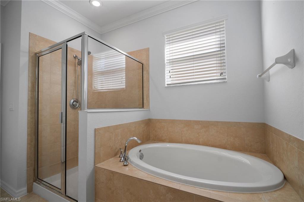 21620 Bella Terra Boulevard Estero, FL 33928 - Photo 19 of 37 a bathroom with a bathtub and a shower