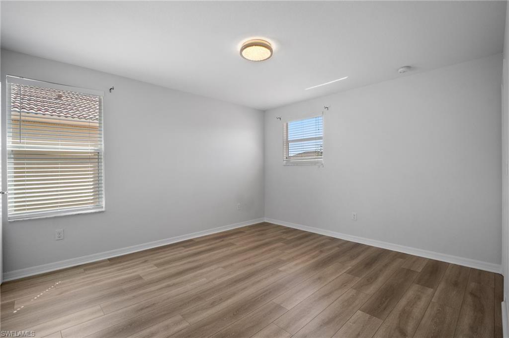 21620 Bella Terra Boulevard Estero, FL 33928 - Photo 24 of 37 a view of empty room with wooden floor
