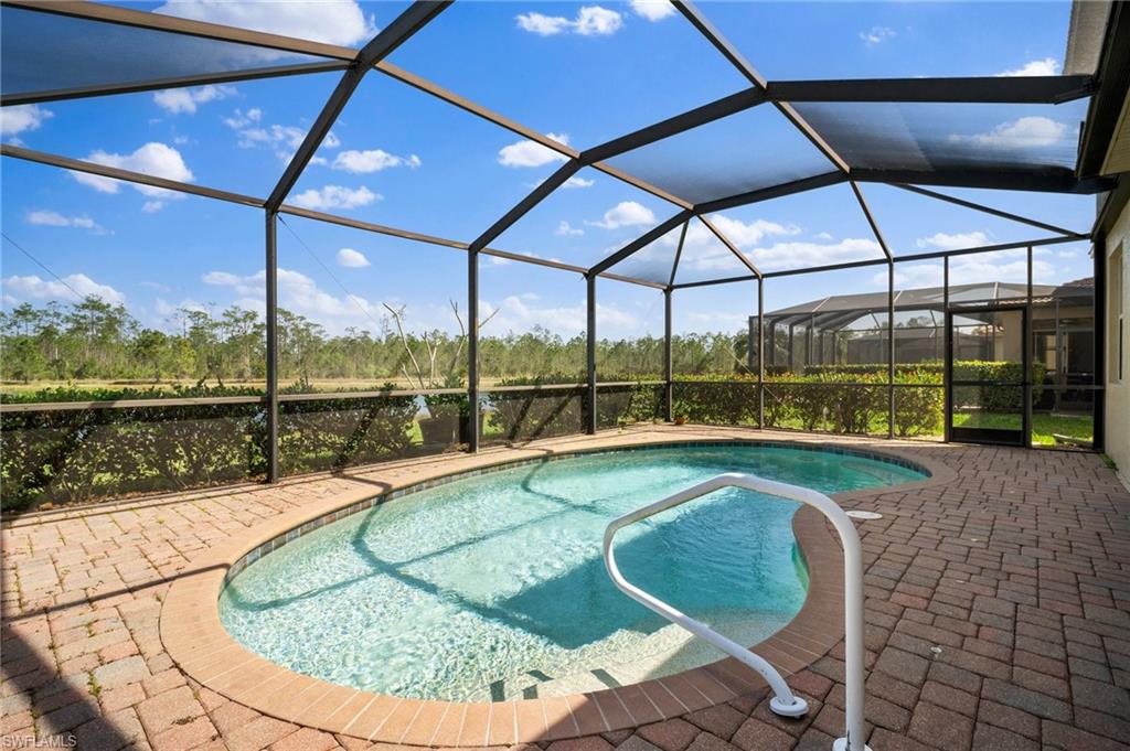 21620 Bella Terra Boulevard Estero, FL 33928 - Photo 32 of 37 a view of a swimming pool with a porch