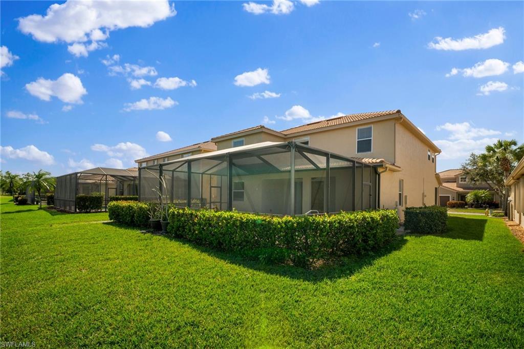 21620 Bella Terra Boulevard Estero, FL 33928 - Photo 34 of 37 a view of a back yard of the house