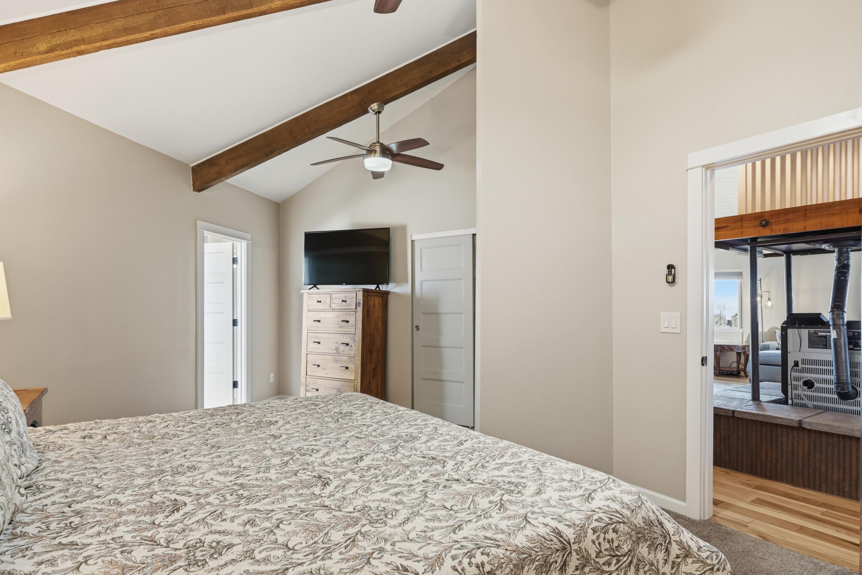 4074 Southwest Reif Road Powell Butte, OR 97753 - Photo 15 of 59 a bedroom with a bed and a dresser