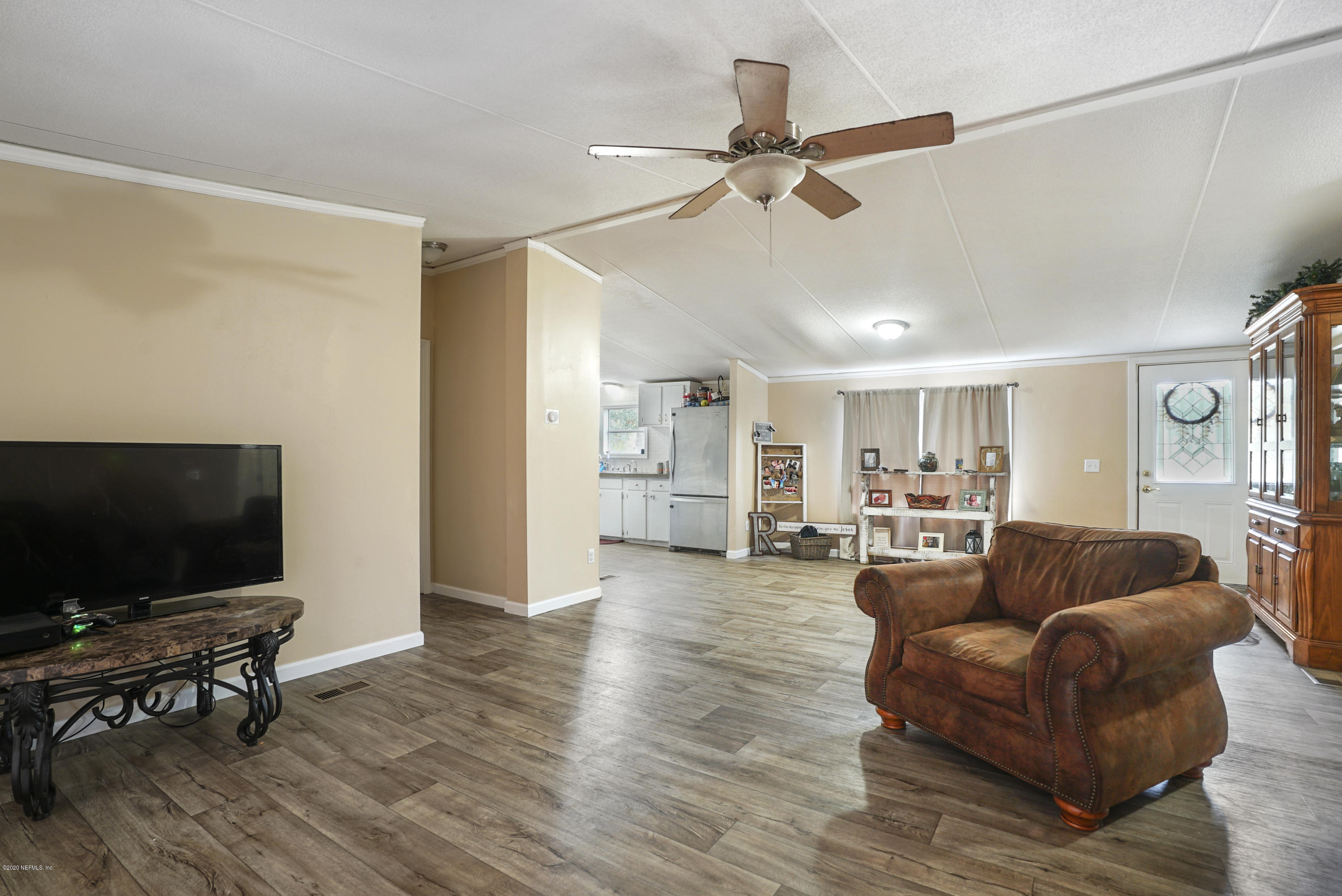 1435 Long Bay Road Middleburg, FL 32068 - Photo 14 of 27 a living room with furniture and a flat screen tv